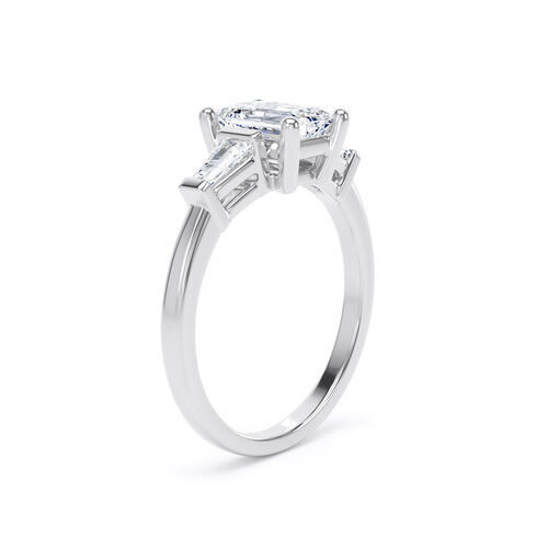 Emerald cut diamond and tapered baguette trilogy ring