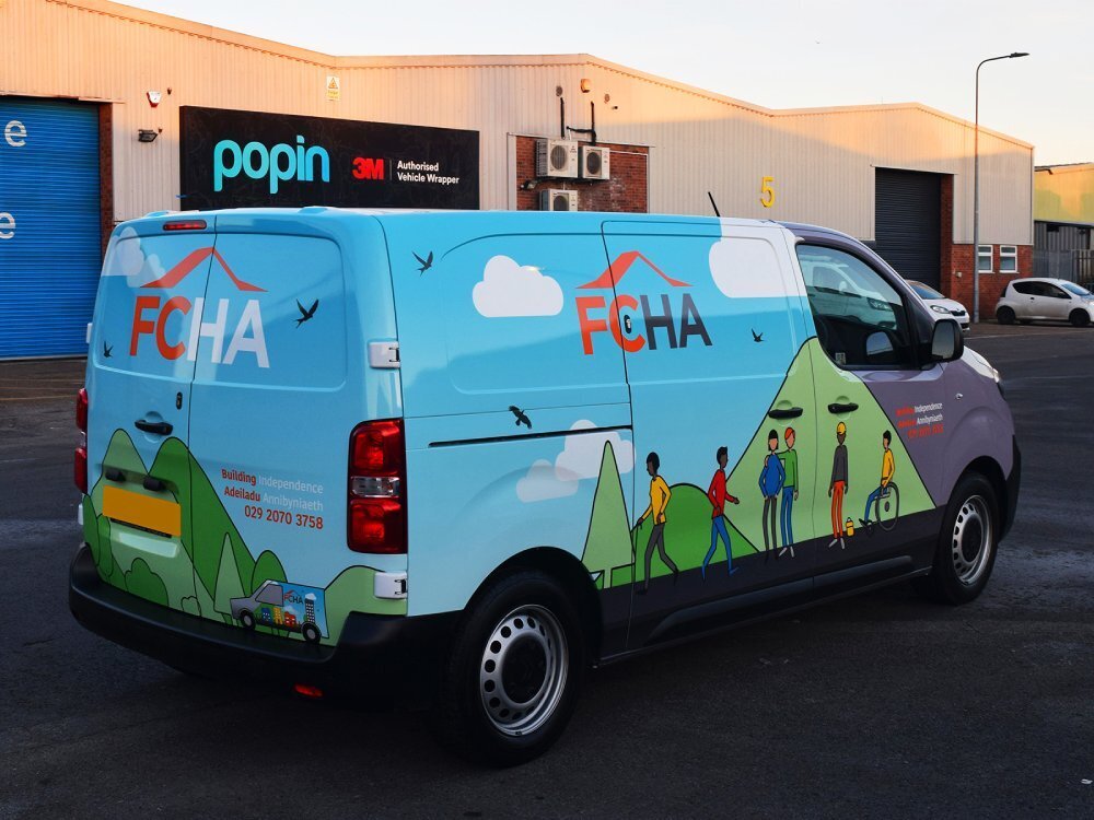 A Citroen Dispatch company van with a colourful full vehicle wrap.