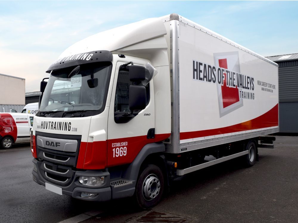 DAF LF truck with vehicle graphics.