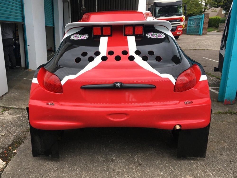 Motorsport wrap and graphics on rear of a Peugeot 206 rally car