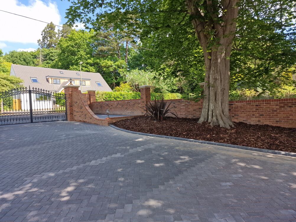 150 metre Boundary Brickwork Wall and 285 sqm Block Paving. Special piling and steelwork design provisions taken to protect TPO tree roots.