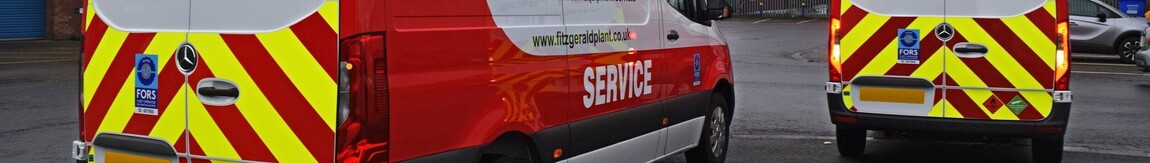 Reflective chevron vehicle vinyl graphics on rear of business vans.