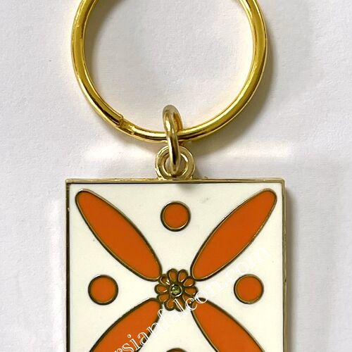 Charm. The Persian Cross. Orange on White with 1 Central Green Stone.