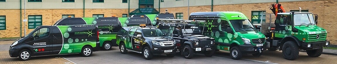 Entire fleet of various company vehicles with matching branded wraps and vinyl graphics.