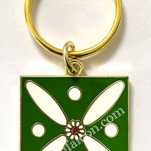Charm. The Persian Cross. White on Green with 1 Central Red Stone.