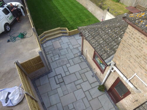 Turfing. Striped lawn with new patio, Landscaping in dorchester