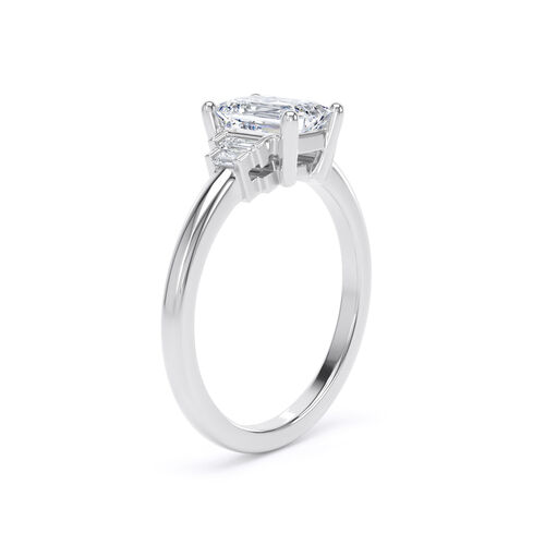 Emerald cut solitaire with stepped baguette cut diamond shoulders