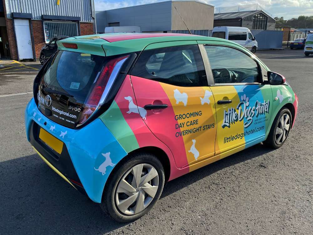 Toyota Aygo company car with colourful branded full vehicle wrap.