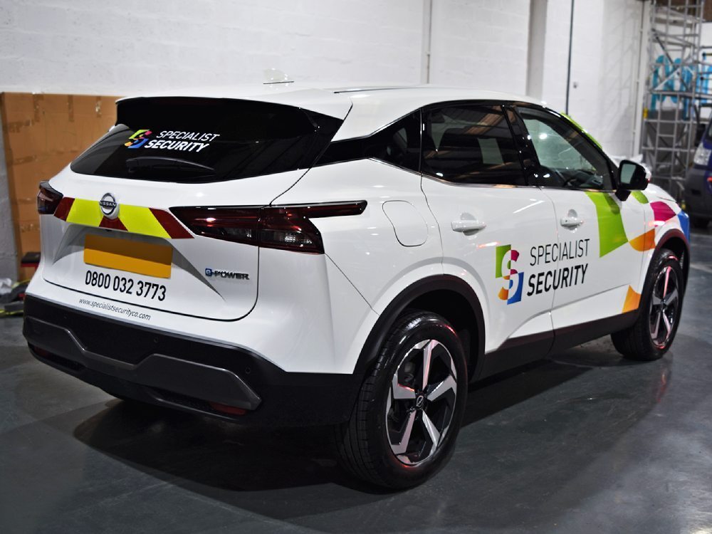 Nissan Juke e-POWER electric company car with business branded vinyl graphics.