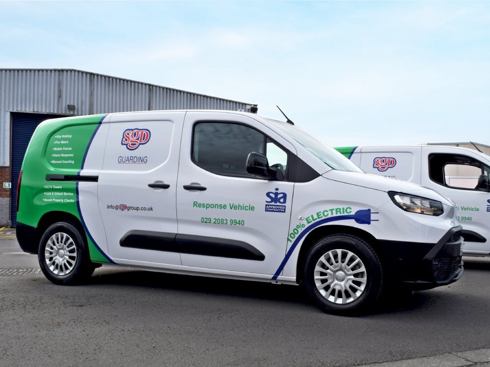 Fleet of Toyota Proace City Verso electric vans with branded partial wrap and company graphics.