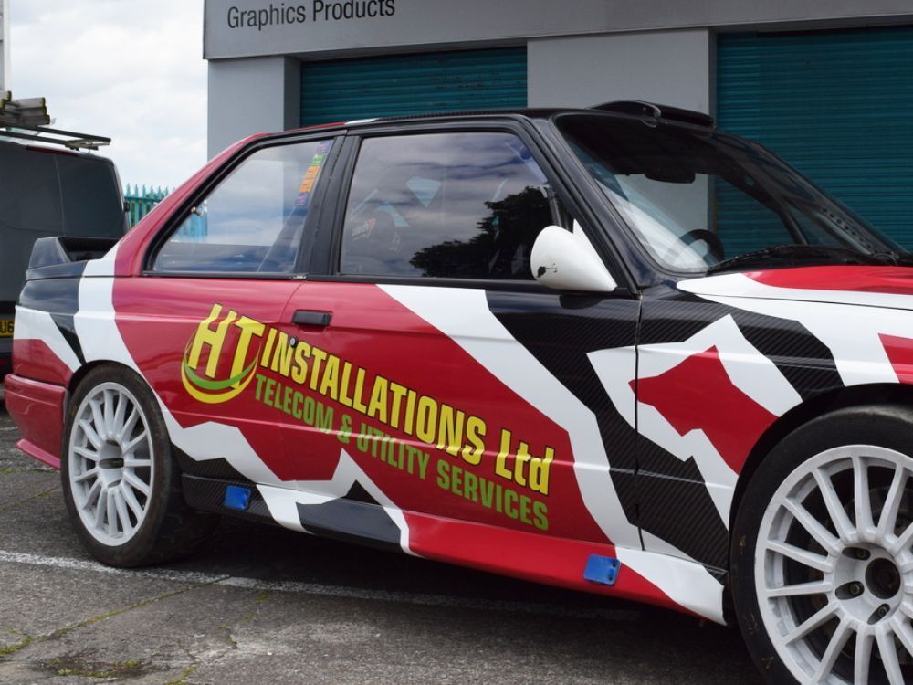 Company branded car wrap and vinyl graphics on a BMW E30.