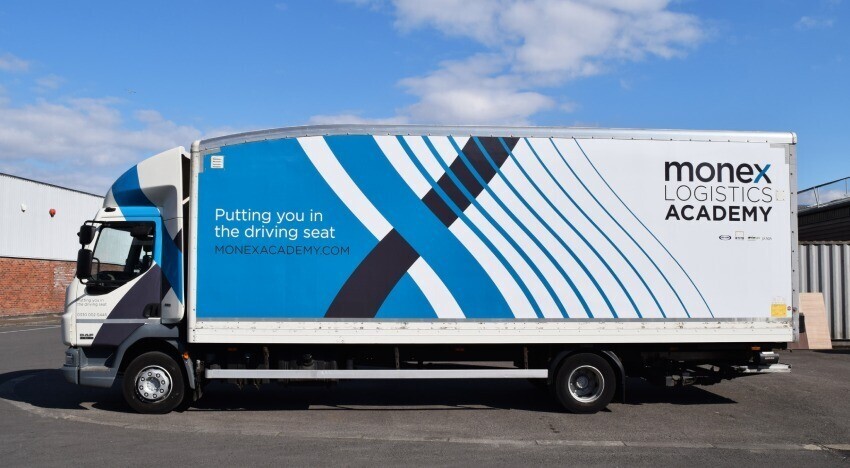 Motorsport livery and graphics on a yellow Abarth 595 Competizione sports car