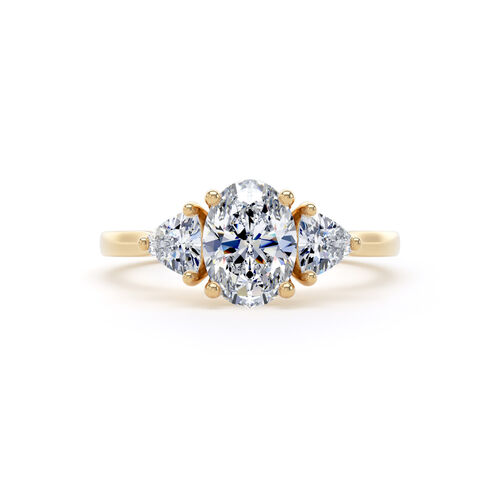 Oval and trilliant cut trilogy ring