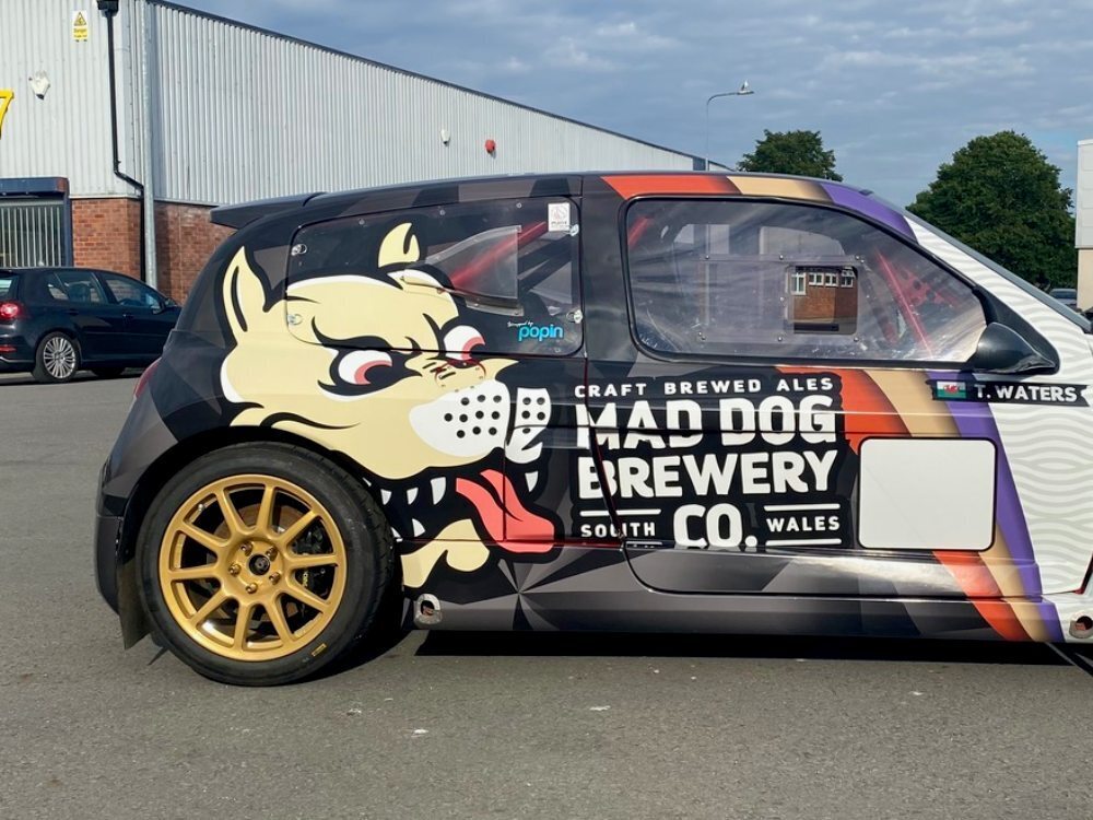 Back end of Renault Clio V6 sports car with race graphics