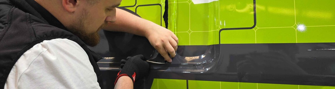 Permanent branded vehicle wrap being installed on business van at Popin in Cardiff.