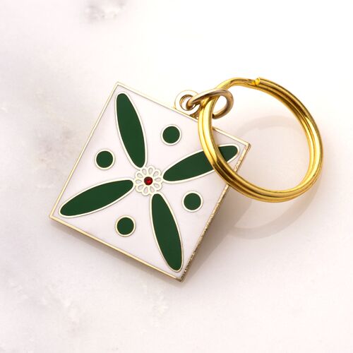 Charm. The Persian Cross. White on Green with 1 Central Red Stone.