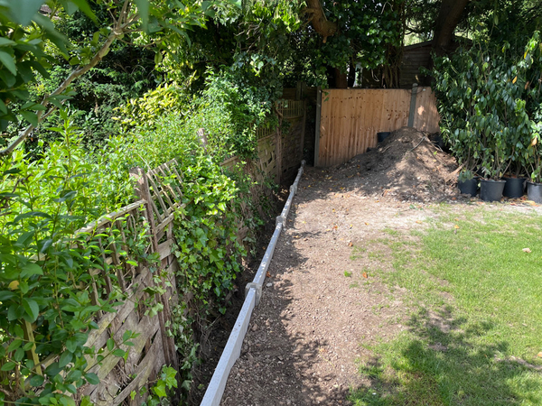 Successfully Resolving a  Boundary Dispute: Installing a Retaining Wall to Address Soil Spilling and Nuisance