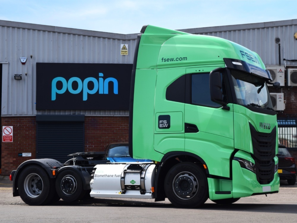 Green vehicle wrap on an Iveco lorry cab parked outside Popin in Cardiff.