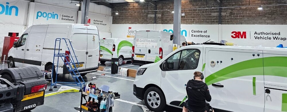 Vinyl wrap installation on leased commercial vans.