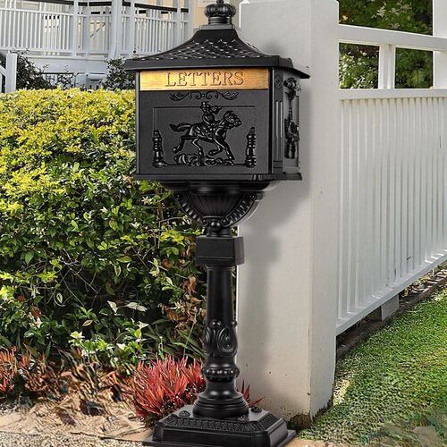 Large red metal postbox.