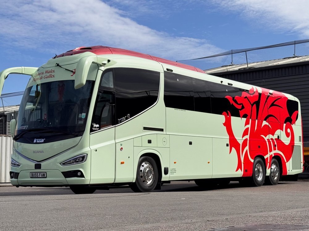 FAW Welsh national football team coach with branded vehicle wrap.