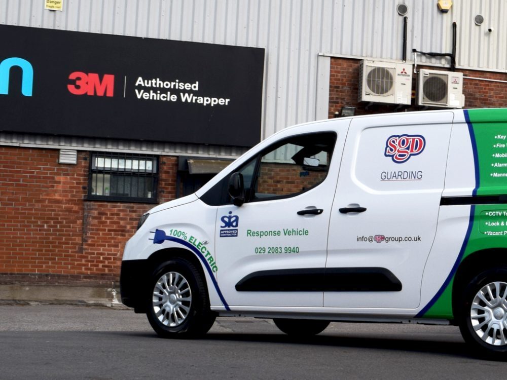 Vehicle vinyl graphics on white company Toyota Proace van.