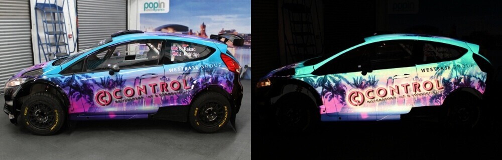 Branded company car with reflective vinyl branding shown in daylight and glowing at night in the dark.