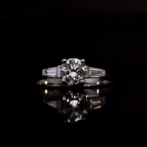 Round diamond and tapered baguette trilogy ring in Platinum