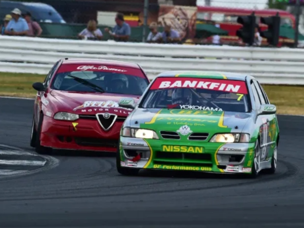 Motorsport livery and graphics on a Nissan Primera race car