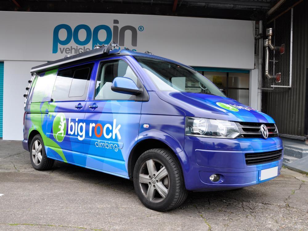 Blue full company branded van wrap on Volkswagen California outside Popin in Cardiff.