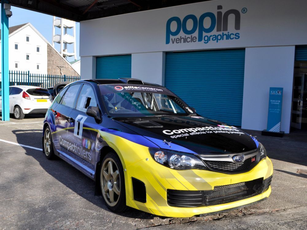 Motorsport livery and graphics on a Subaru Impreza B13 rally car