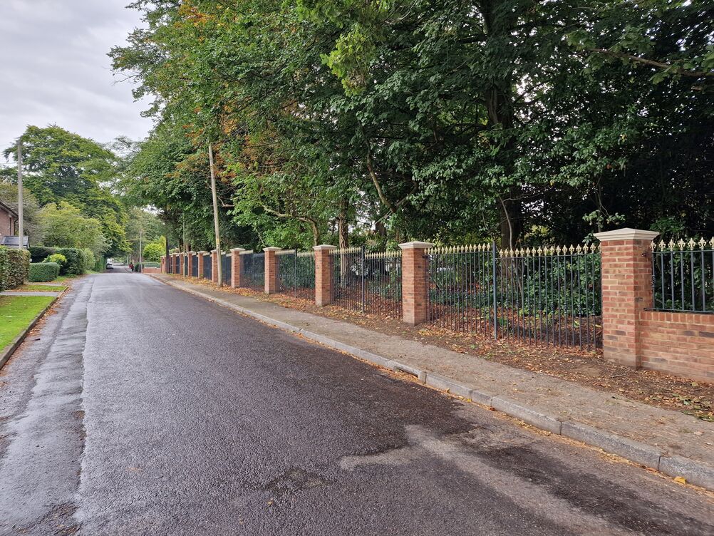 150 metre Boundary Brickwork Wall and 285 sqm Block Paving. Special piling and steelwork design provisions taken to protect TPO tree roots.