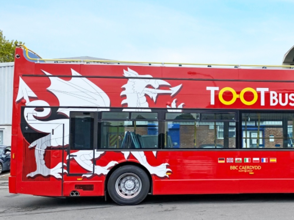 Rear end of red Ayats Bravo city open top bus with Tootbus vinyl graphics.toot bus