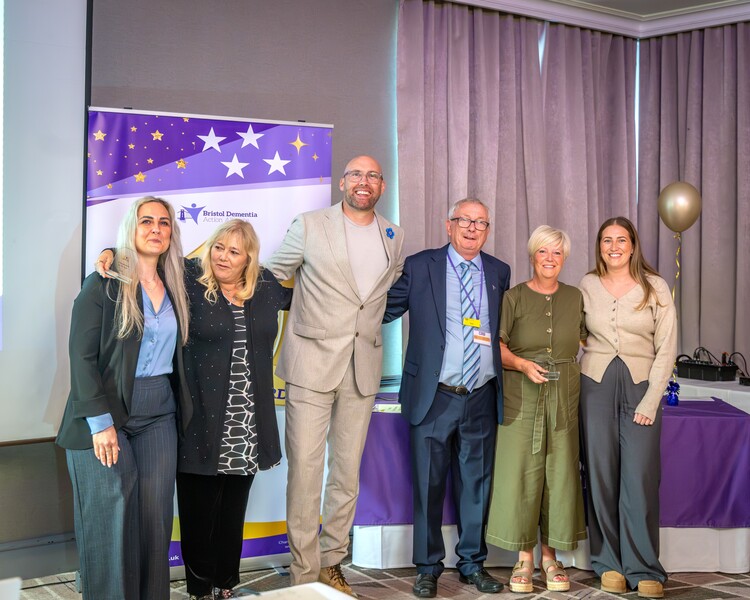 Your Care founder Tina Westlake and director Claire Westlake celebrating their award win at the Bristol Dementia Action Alliance Awards 2026, alongside BBC Radio Bristol presenter Joe Sims and BDAA founder Tony.