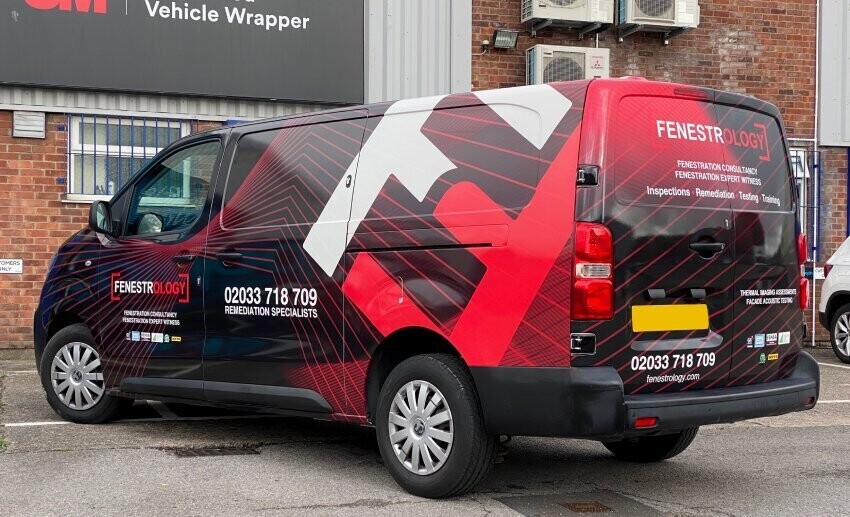 Red and black commercial van wrap design with clear branding and contact details.