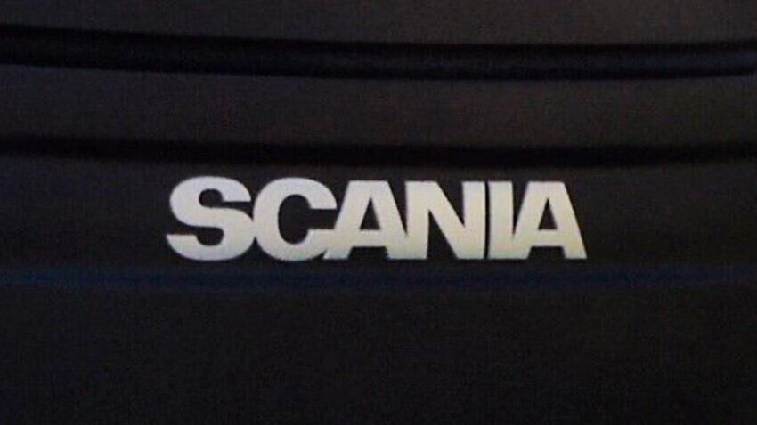 Scania logo on front of coach.