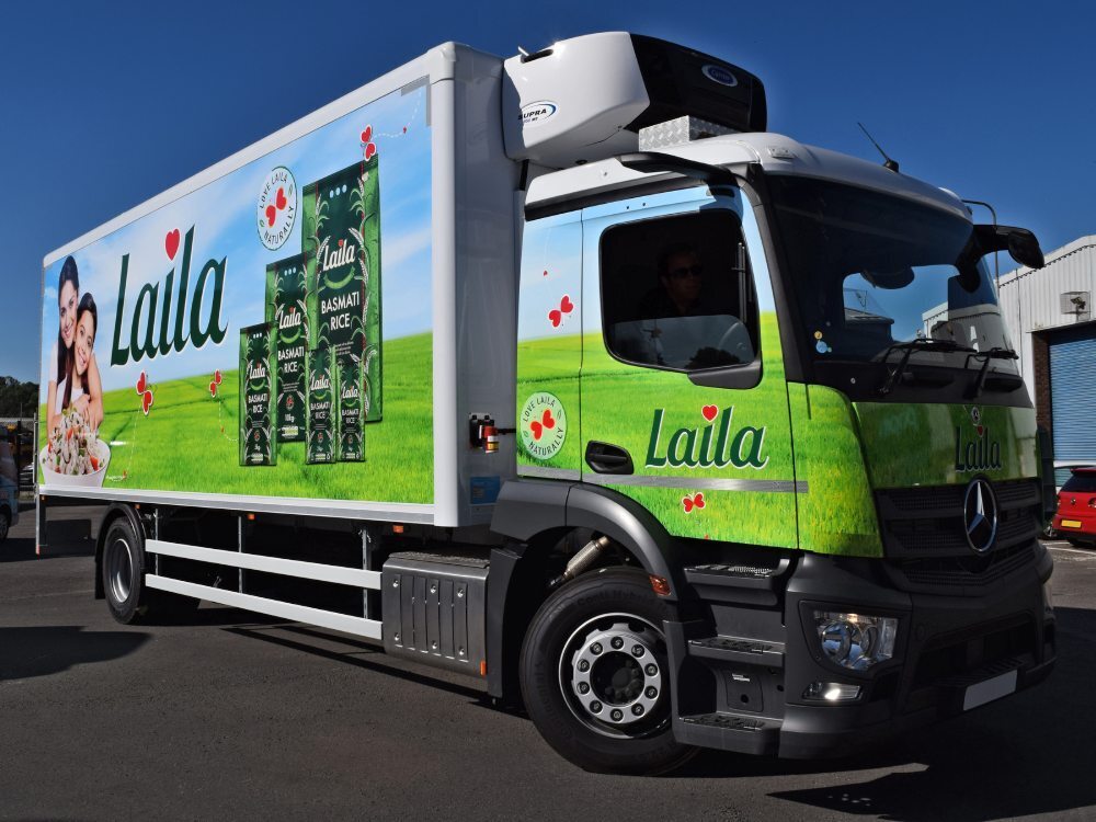 Full company branded vehicle wrap on a Mercedes truck.