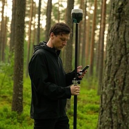 How can topographical surveys help in designing drainage systems?