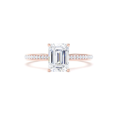 Emerald cut solitaire with channel set diamond shoulders