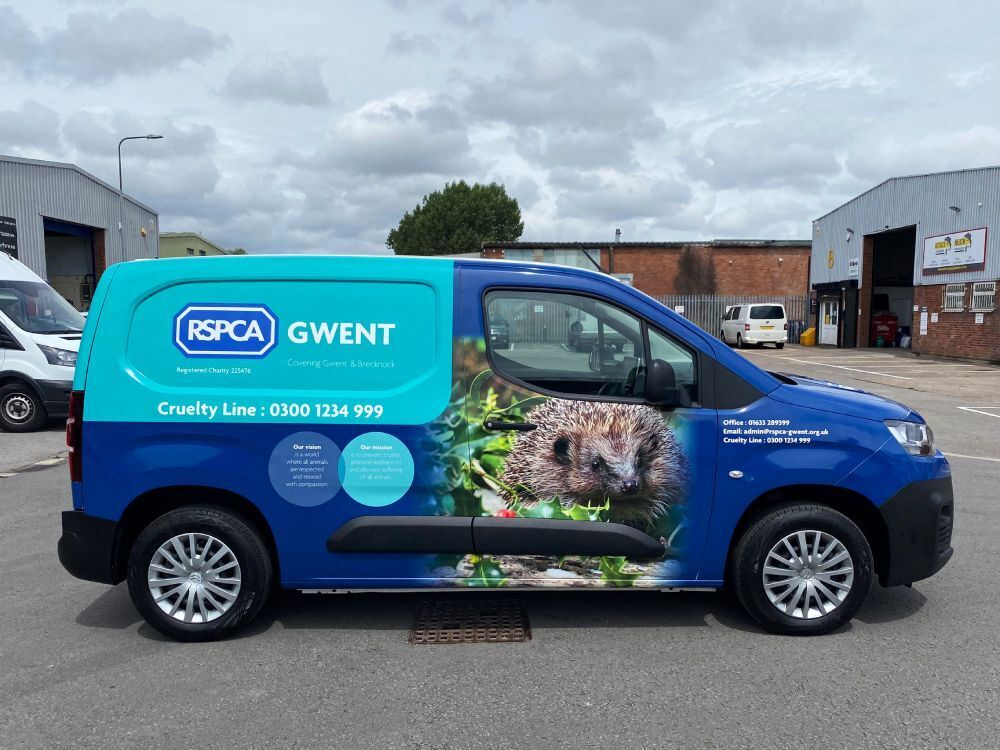 Citroen Berlingo company van with RSPCA vehicle wrap and graphics.