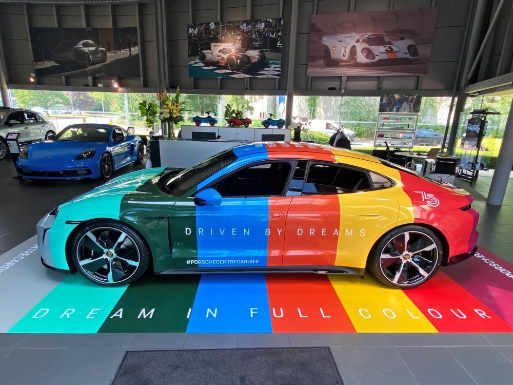 Colourful full vehicle wrap on Porsche Taycan Turbo.