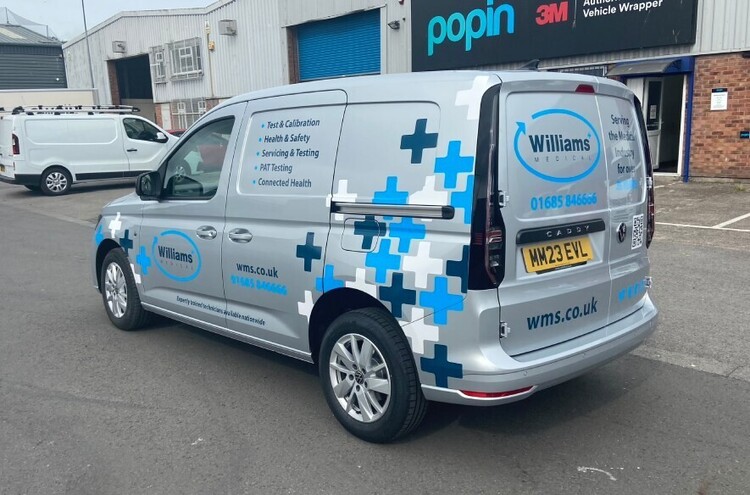 Calendered vinyl vehicle graphics on a company van
