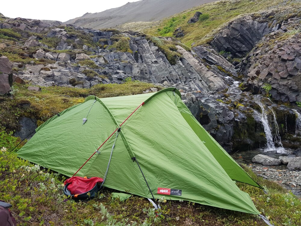 Campsite beside a waterfall in Hornstrandir, Iceland – wild camping near the coast