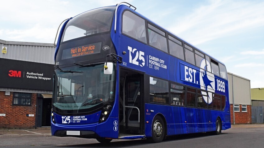 Alexander Dennis Enviro 400 double decker bus with blue Cardiff City FC vehicle wrap outside Popin.