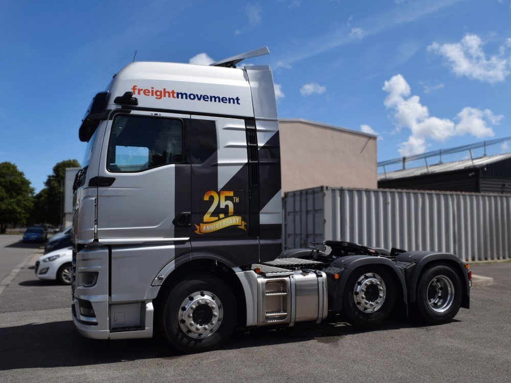 Branded vehicle wrap and graphics on a MAN lorry.