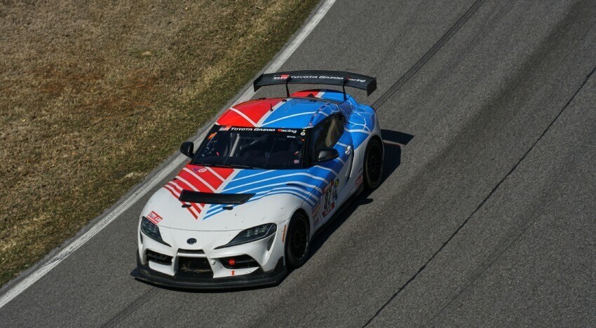 Custom motorsport livery and vinyl graphics on Toyota GR Supra race car