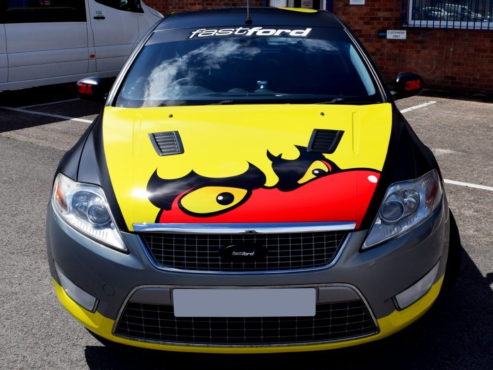 Monster face vinyl graphics on bonnet of a Ford Mondeo race car
