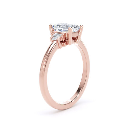 Emerald cut solitaire with stepped baguette cut diamond shoulders