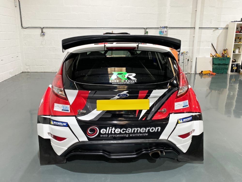 Rear end of Ford Fiesta R5 company car with commercial wrap.