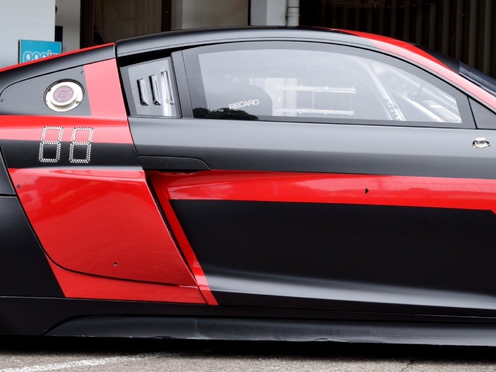 Side of Audi R8 with custom red and black motorsport livery